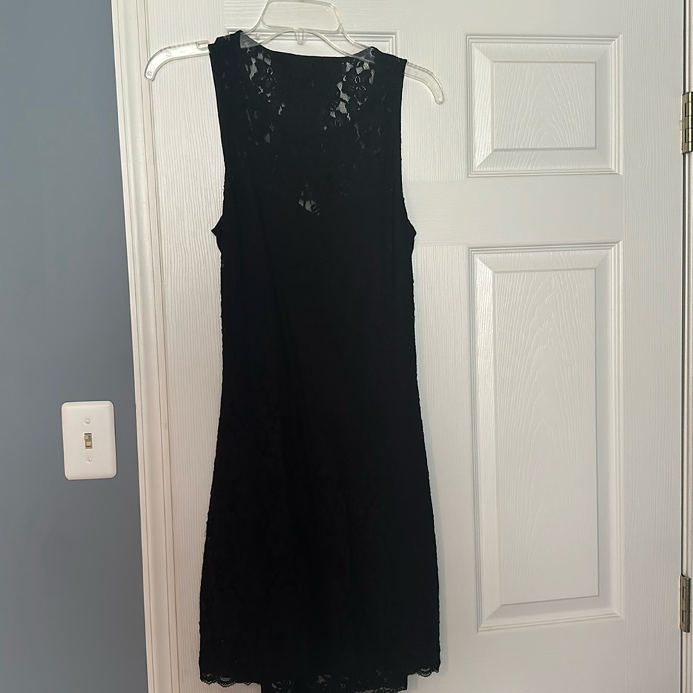 Women’s black lace dress with open back